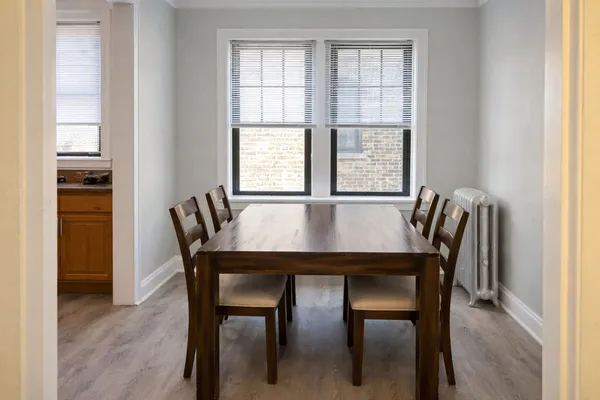 a view of a dining room with furniture and window