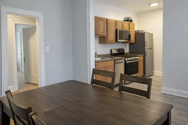 a kitchen with a appliances and cabinets