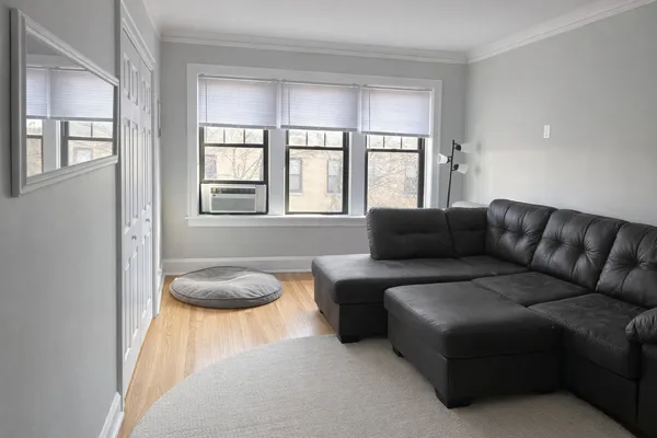 a living room with furniture and a window