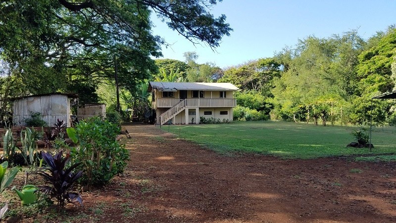 4940 Awawa Road Hanapepe, HI 96705 - Photo 1 of 22 a front view of a house with garden