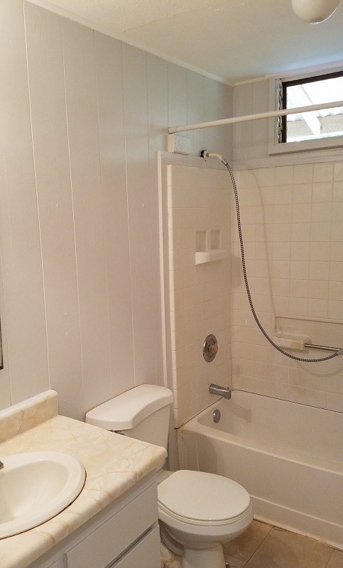 4940 Awawa Road Hanapepe, HI 96705 - Photo 13 of 22 a white toilet and tub next to a bathroom sink