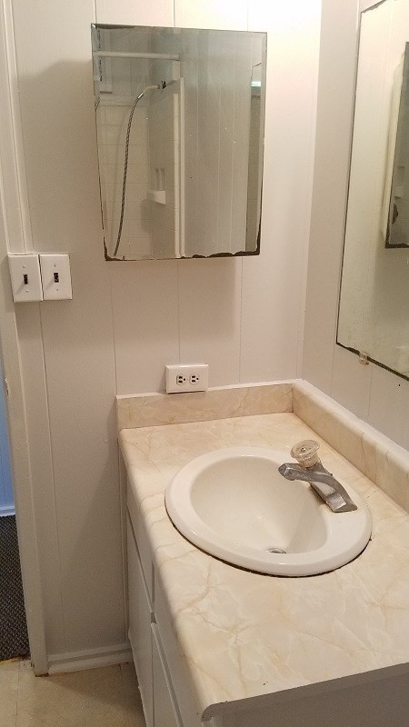 4940 Awawa Road Hanapepe, HI 96705 - Photo 14 of 22 a bathroom with a sink and a mirror