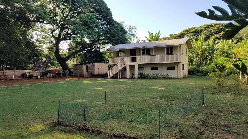 4940 Awawa Road Hanapepe, HI 96705 - Photo 18 of 22 a front view of a house with a yard