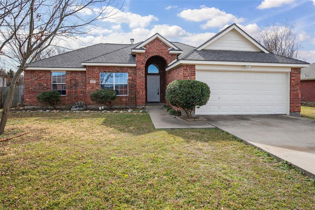 407 Autry Boulevard Gunter, TX 75058 - Photo 1 of 28 a view of a house with a yard and large tree