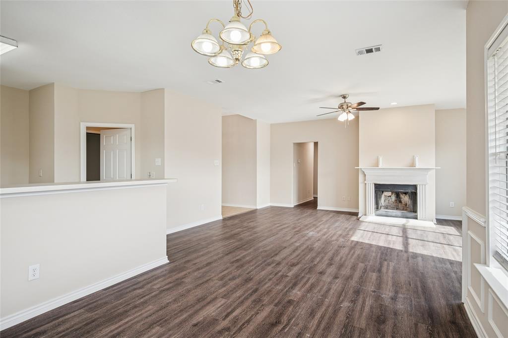 407 Autry Boulevard Gunter, TX 75058 - Photo 14 of 28 a view of an empty room with wooden floor and a window