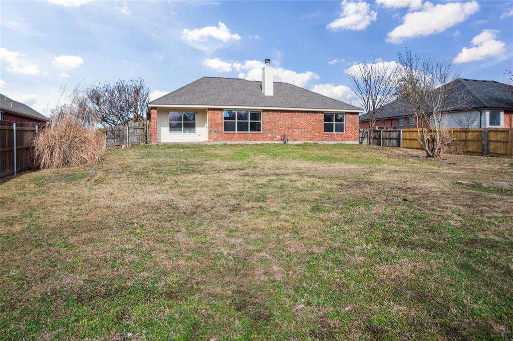 407 Autry Boulevard Gunter, TX 75058 - Photo 23 of 28 a front view of a house with yard