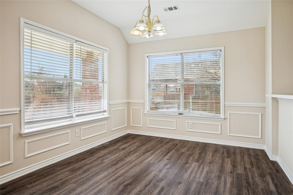 407 Autry Boulevard Gunter, TX 75058 - Photo 9 of 28 a view of an empty room with wooden floor and a window