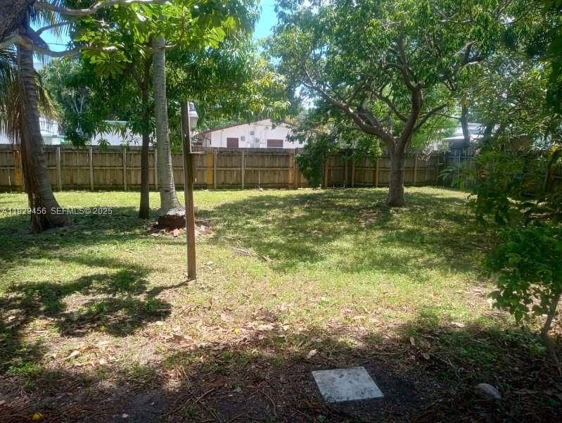 1820 Funston Street, Unit A Hollywood, FL 33020 - Photo 6 of 6 a view of a yard with a tree