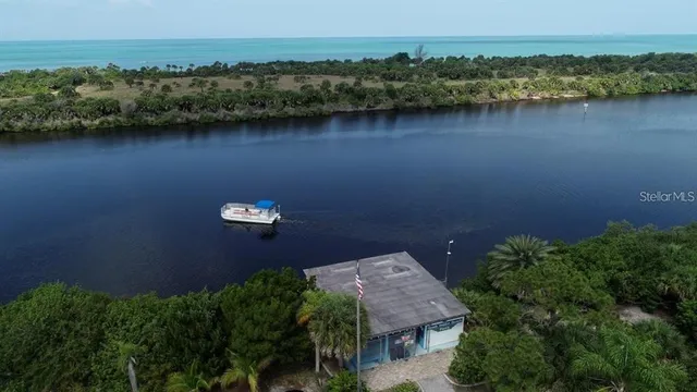 an aerial view of a house with a lake view