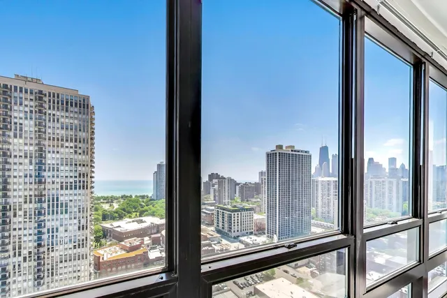 a bathroom with a double vanity sink mirror and toilet