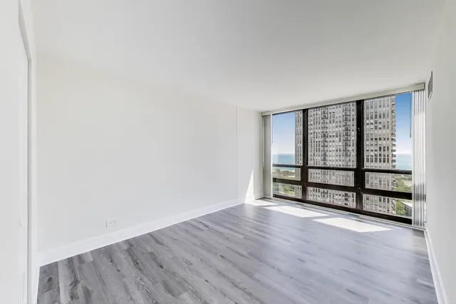 a room with painting and a potted plant