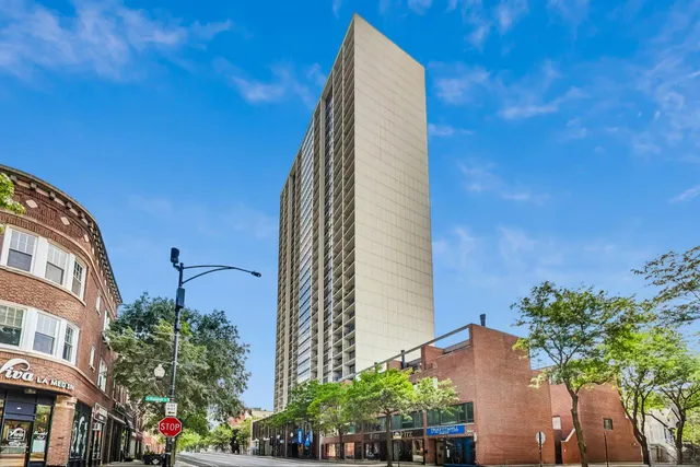 a building with potted plants in front of it