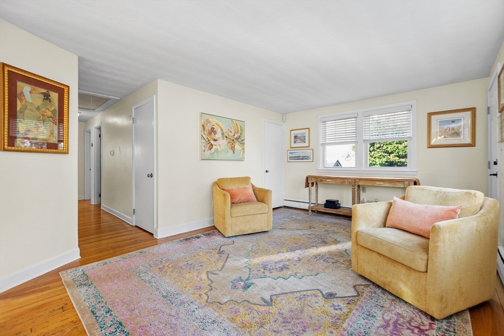 2 Lodge Road Natick, MA 01760 - Photo 11 of 36 a living room with furniture and a wooden floor