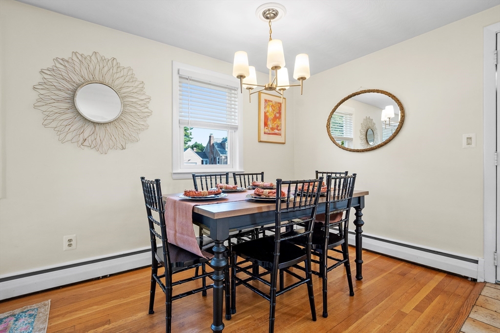 2 Lodge Road Natick, MA 01760 - Photo 13 of 36 a view of a dining room with furniture and wooden floor