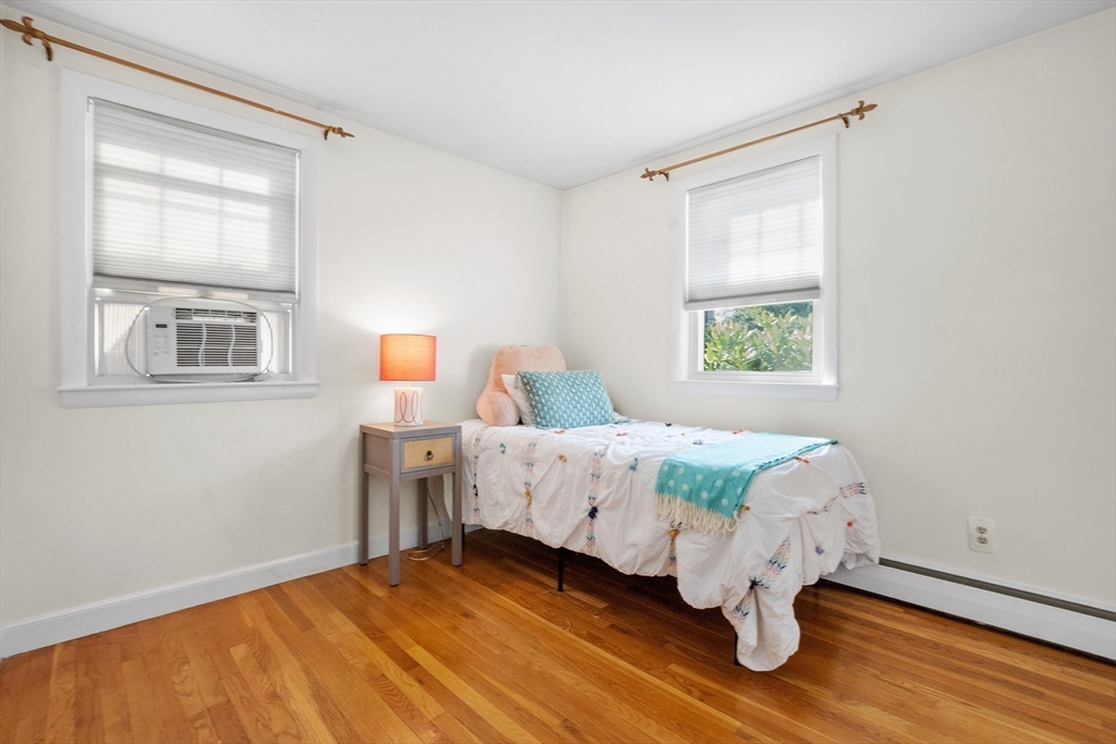 2 Lodge Road Natick, MA 01760 - Photo 15 of 36 a bedroom with a bed table and window
