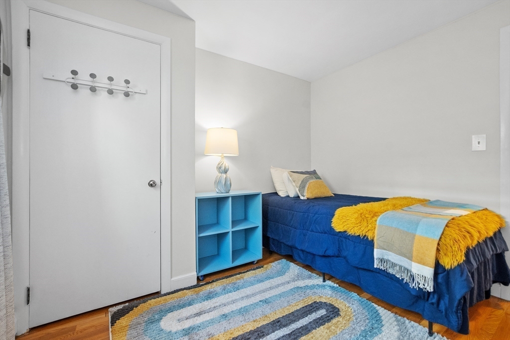 2 Lodge Road Natick, MA 01760 - Photo 20 of 36 a bedroom with a bed and a lamp