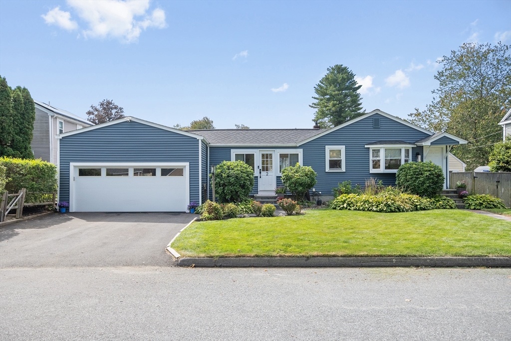 2 Lodge Road Natick, MA 01760 - Photo 2 of 36 a front view of a house with a yard and garage
