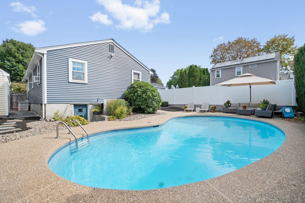 2 Lodge Road Natick, MA 01760 - Photo 32 of 36 a view of a backyard with a tub and chairs