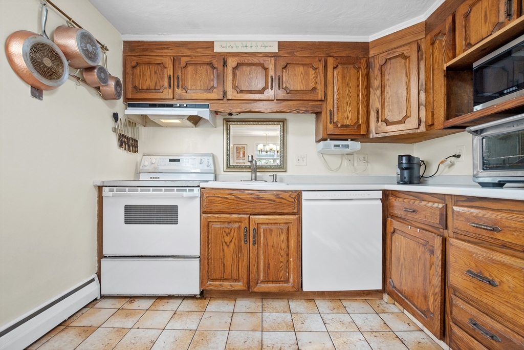 2 Lodge Road Natick, MA 01760 - Photo 8 of 36 a kitchen with stainless steel appliances granite countertop a sink and a stove
