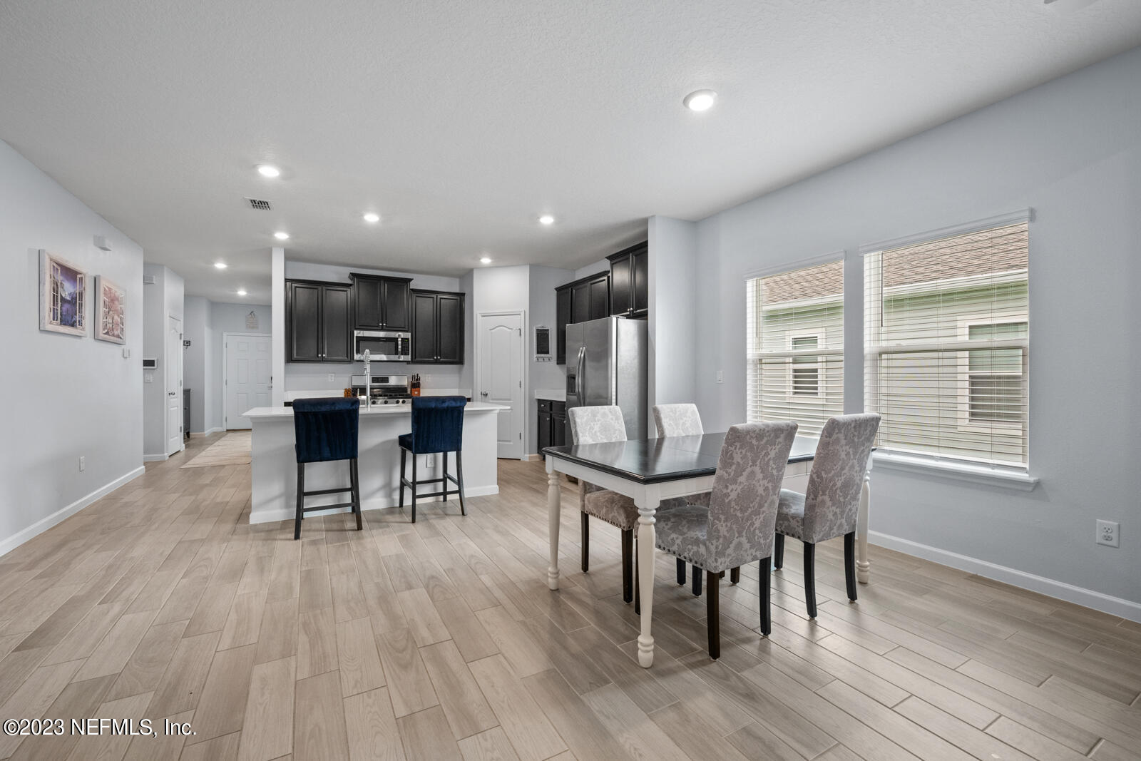 31 Seamount Way St. Augustine, FL 32092 - Photo 14 of 72 a view of a dining room with furniture and wooden floor