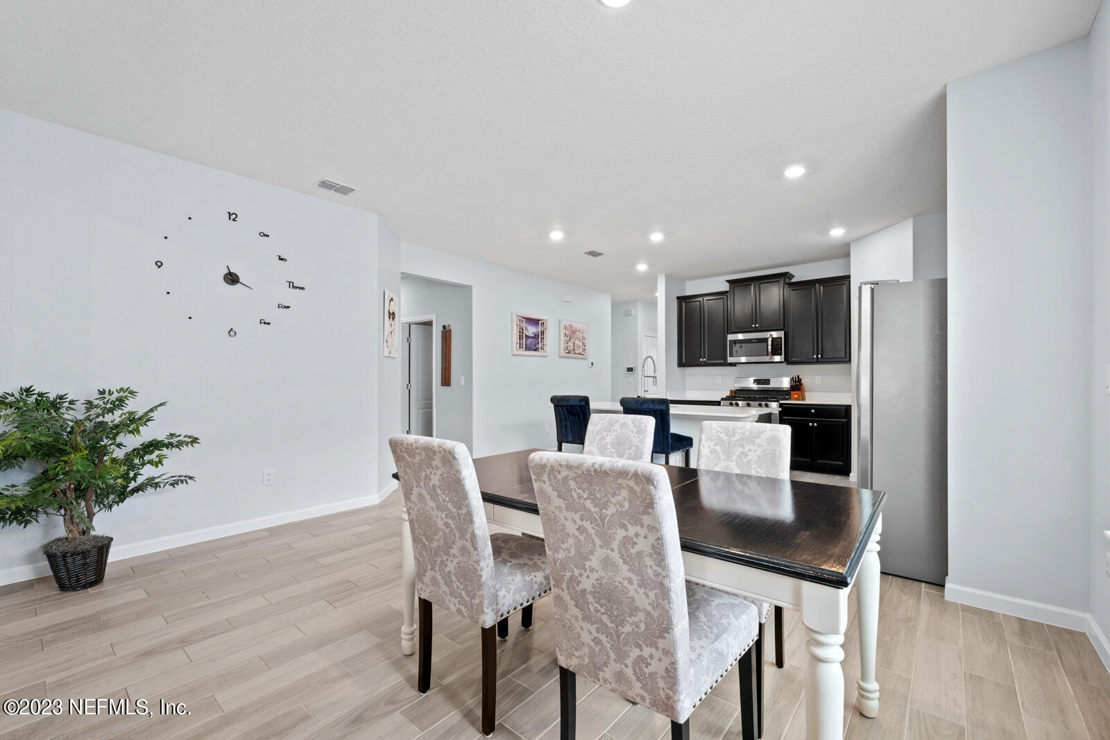 31 Seamount Way St. Augustine, FL 32092 - Photo 15 of 72 a view of a dining room with furniture and wooden floor