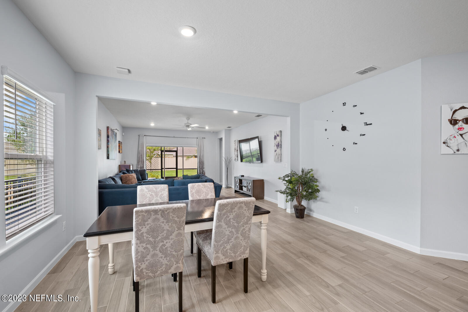 31 Seamount Way St. Augustine, FL 32092 - Photo 16 of 72 a view of a dining room with furniture and wooden floor