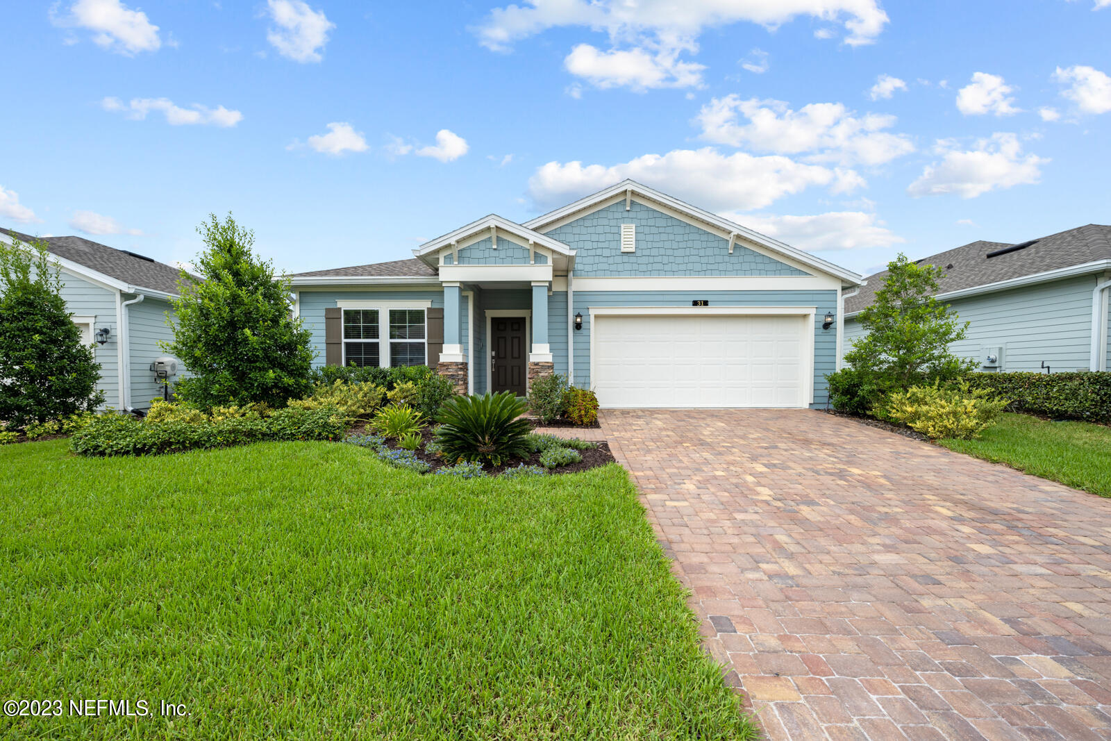 31 Seamount Way St. Augustine, FL 32092 - Photo 2 of 72 a front view of a house with a yard and garage