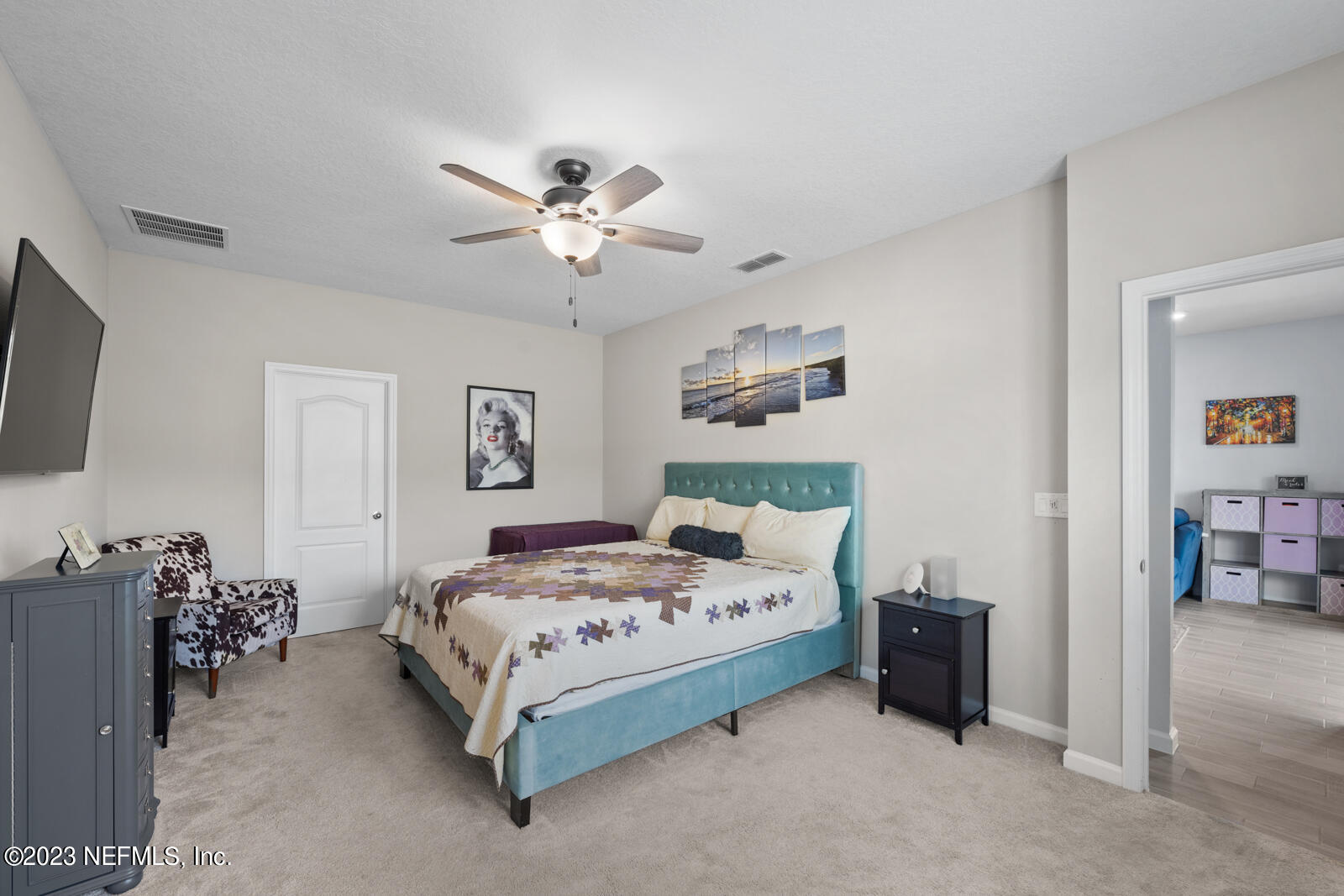 31 Seamount Way St. Augustine, FL 32092 - Photo 25 of 72 a bedroom with a bed and a chandelier