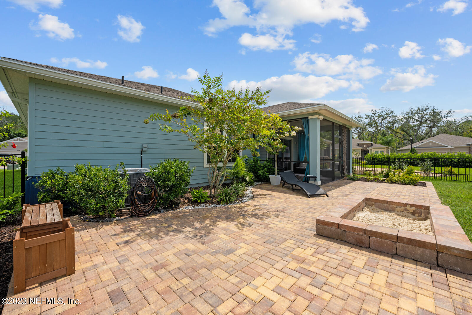 31 Seamount Way St. Augustine, FL 32092 - Photo 33 of 72 a view of a patio with a table and chairs under an umbrella