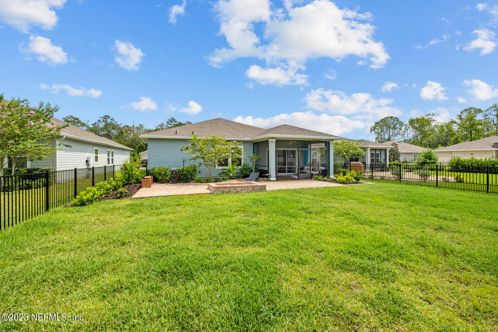 31 Seamount Way St. Augustine, FL 32092 - Photo 36 of 72 a front view of a house with a yard table and chairs