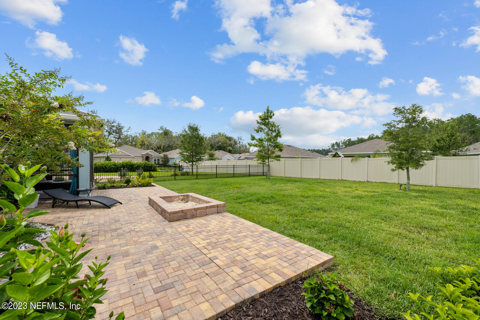 31 Seamount Way St. Augustine, FL 32092 - Photo 37 of 72 a backyard of a house with lots of green space and garden