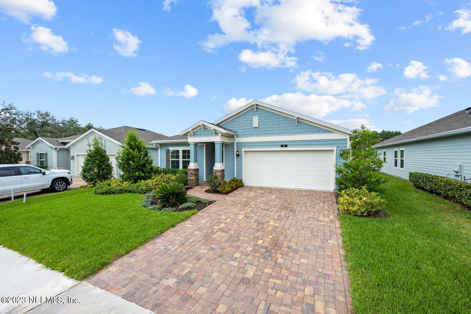 31 Seamount Way St. Augustine, FL 32092 - Photo 38 of 72 a front view of a house with a garden and yard