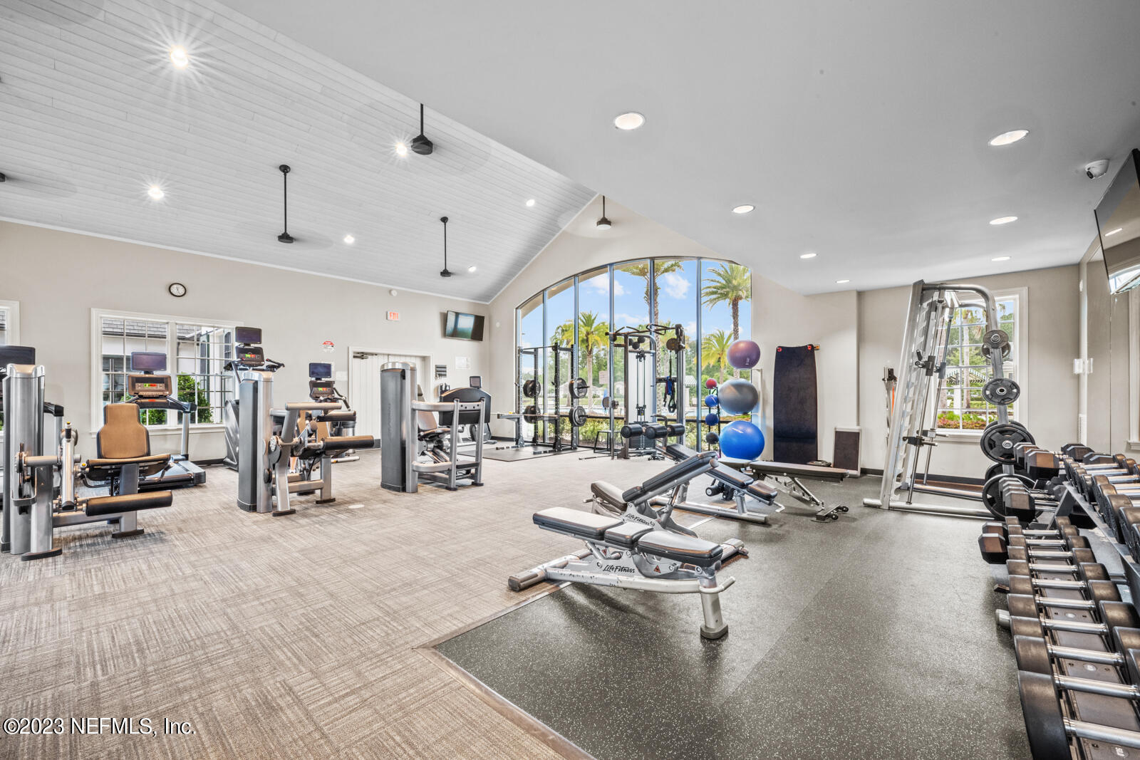 31 Seamount Way St. Augustine, FL 32092 - Photo 50 of 72 a room with lots of gym equipment and a large window