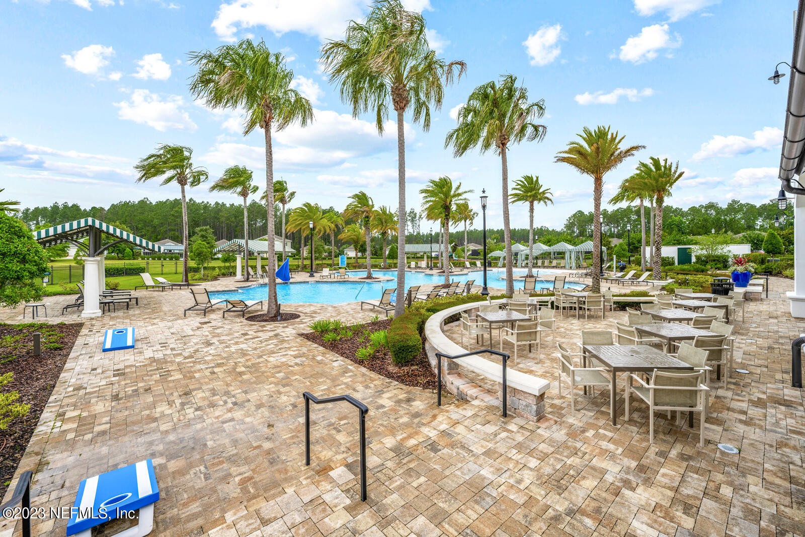 31 Seamount Way St. Augustine, FL 32092 - Photo 56 of 72 a view of a swimming pool with a lawn chairs and a fire pit