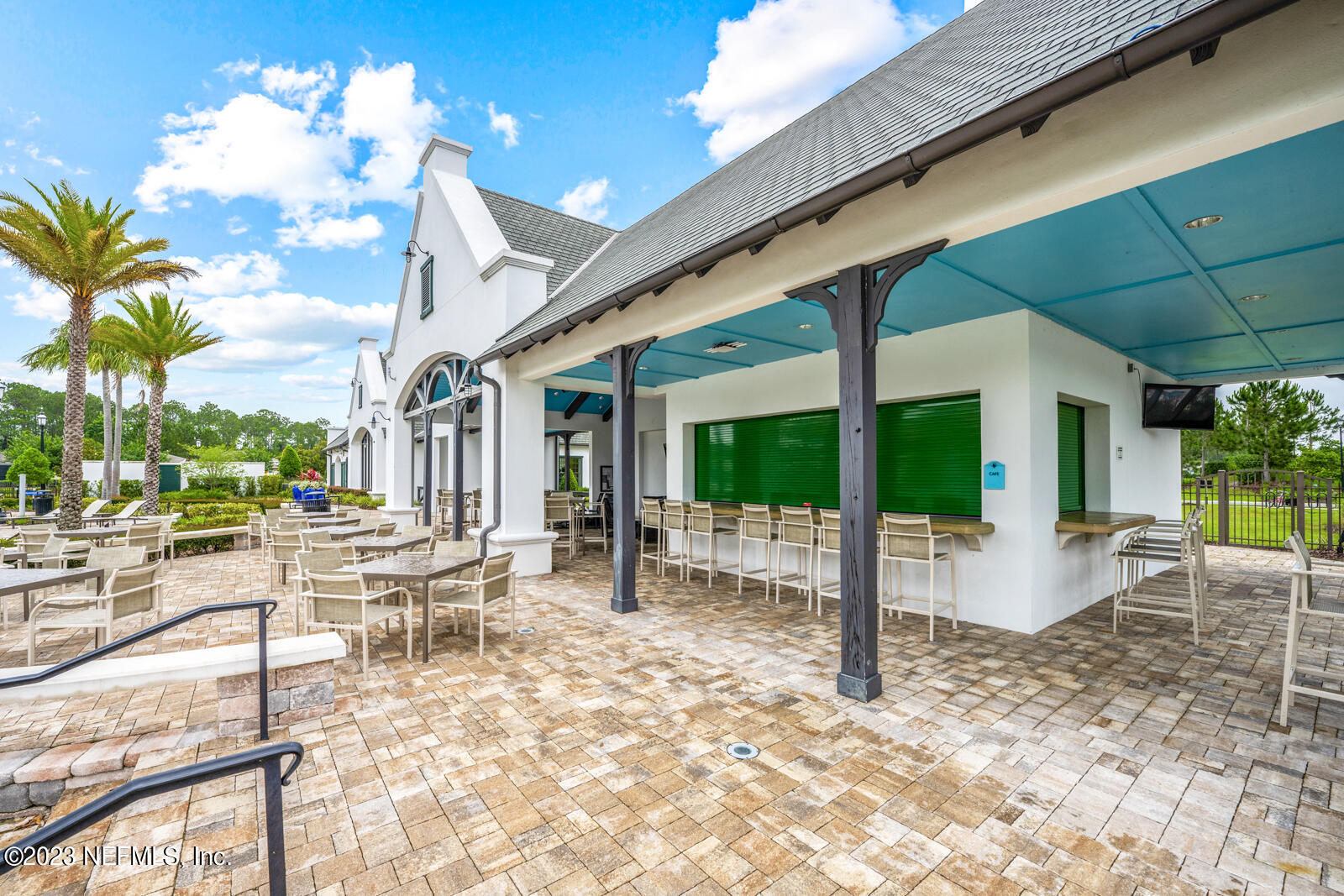31 Seamount Way St. Augustine, FL 32092 - Photo 60 of 72 a view of a patio with table and chairs potted plants and floor to ceiling window