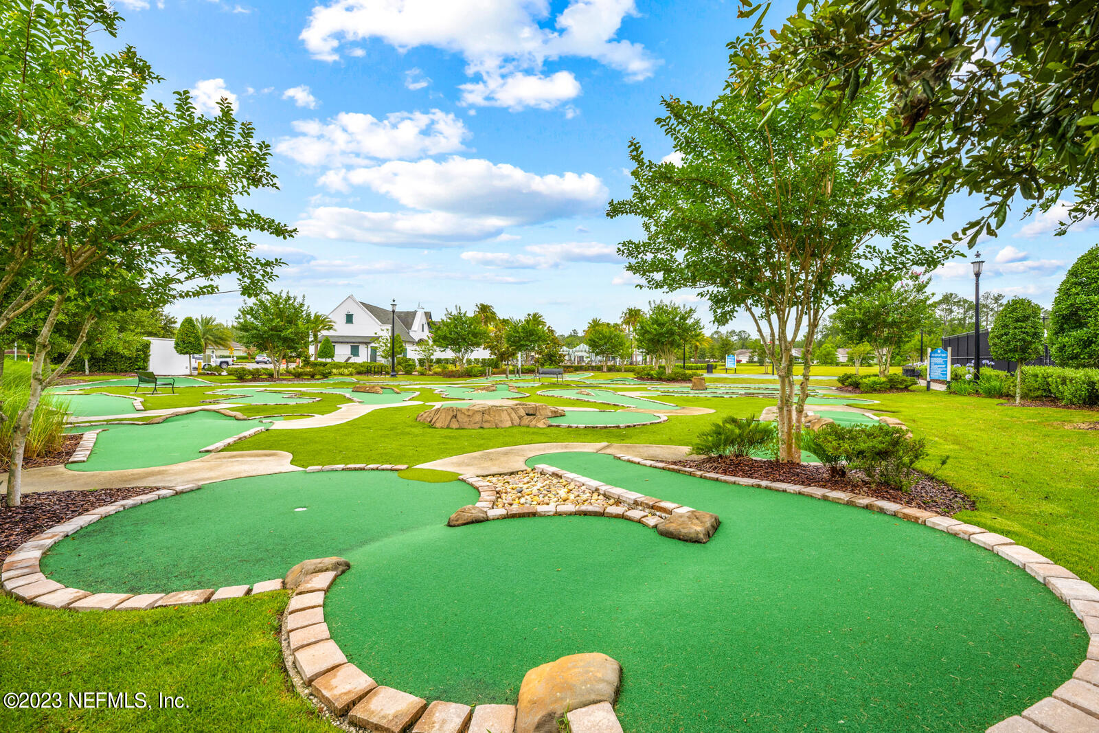 31 Seamount Way St. Augustine, FL 32092 - Photo 65 of 72 a view of a swimming pool and trees in the background