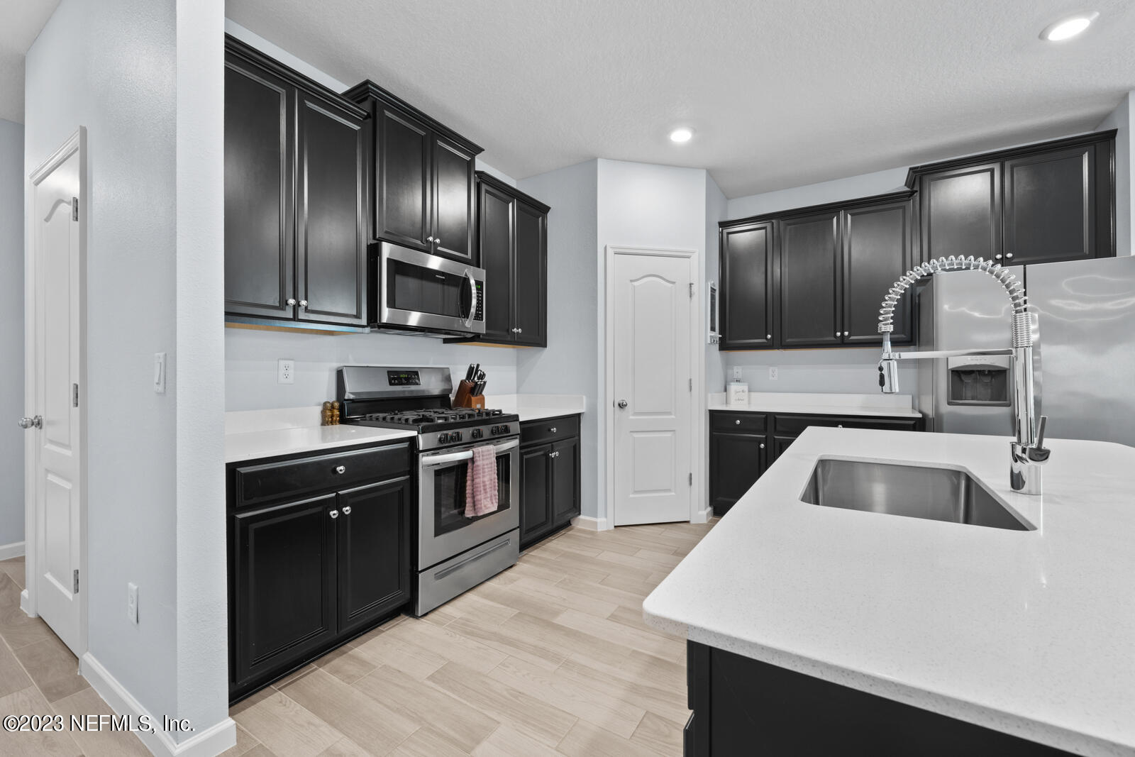 31 Seamount Way St. Augustine, FL 32092 - Photo 10 of 72 a kitchen with granite countertop stainless steel appliances and sink