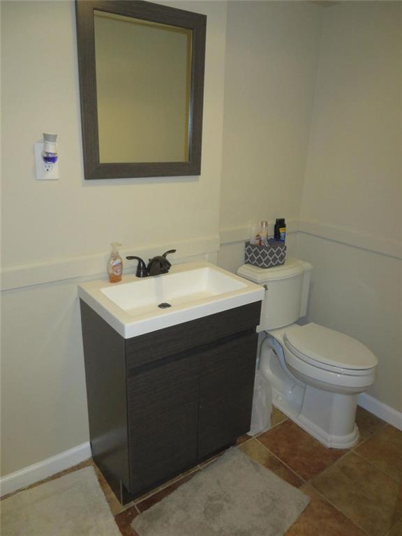 3000 Creel Road Atlanta, GA 30349 - Photo 22 of 52 a bathroom with a toilet sink and mirror