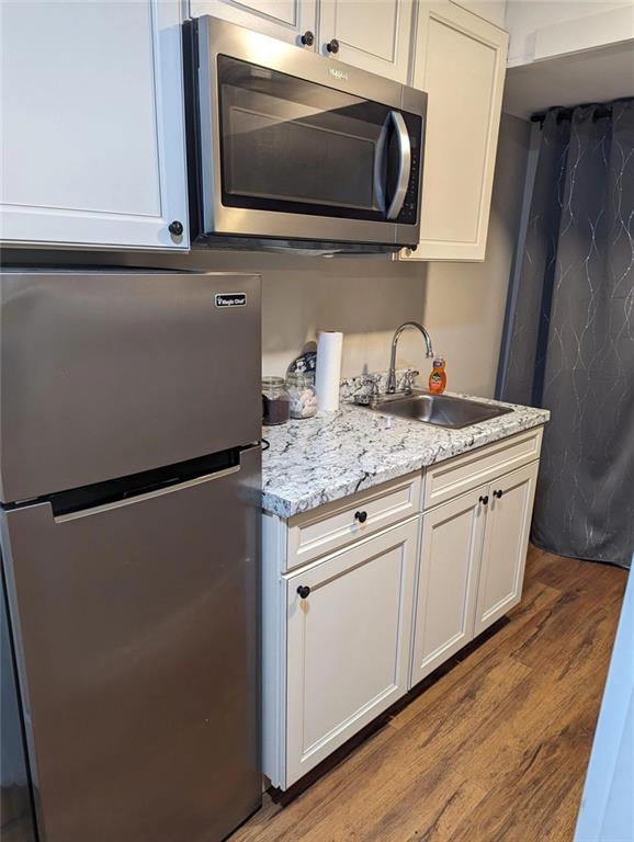 3000 Creel Road Atlanta, GA 30349 - Photo 28 of 52 a kitchen with stainless steel appliances white cabinets and a granite counter tops