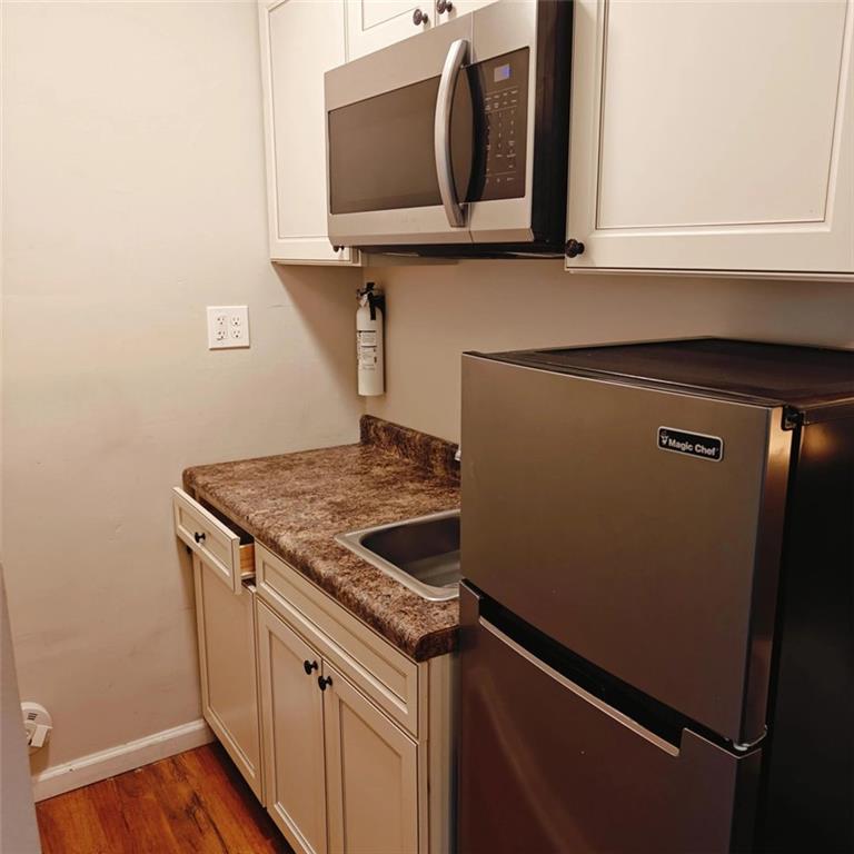 3000 Creel Road Atlanta, GA 30349 - Photo 29 of 52 a stove top oven sitting inside of a kitchen