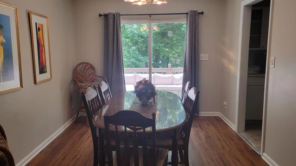 3000 Creel Road Atlanta, GA 30349 - Photo 30 of 52 a dining room with furniture and wooden floor