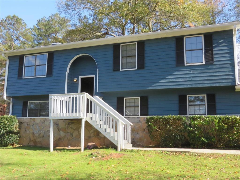 3000 Creel Road Atlanta, GA 30349 - Photo 3 of 52 a front view of a house with garden