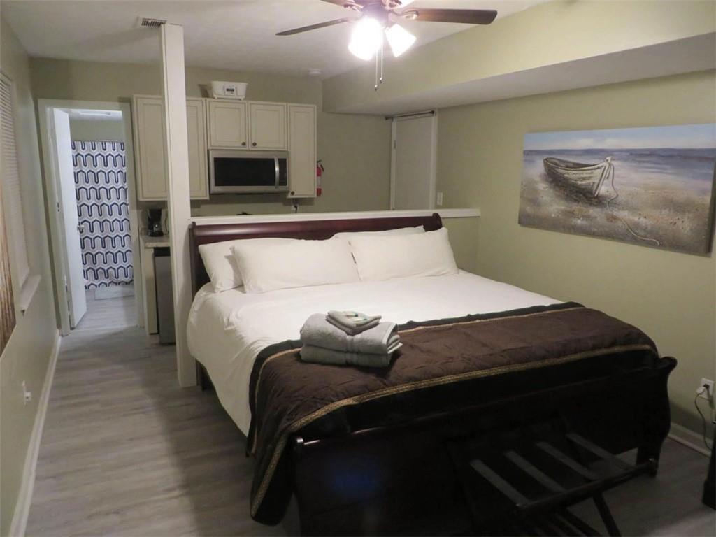 3000 Creel Road Atlanta, GA 30349 - Photo 34 of 52 a bedroom with a bed and a view of bathroom