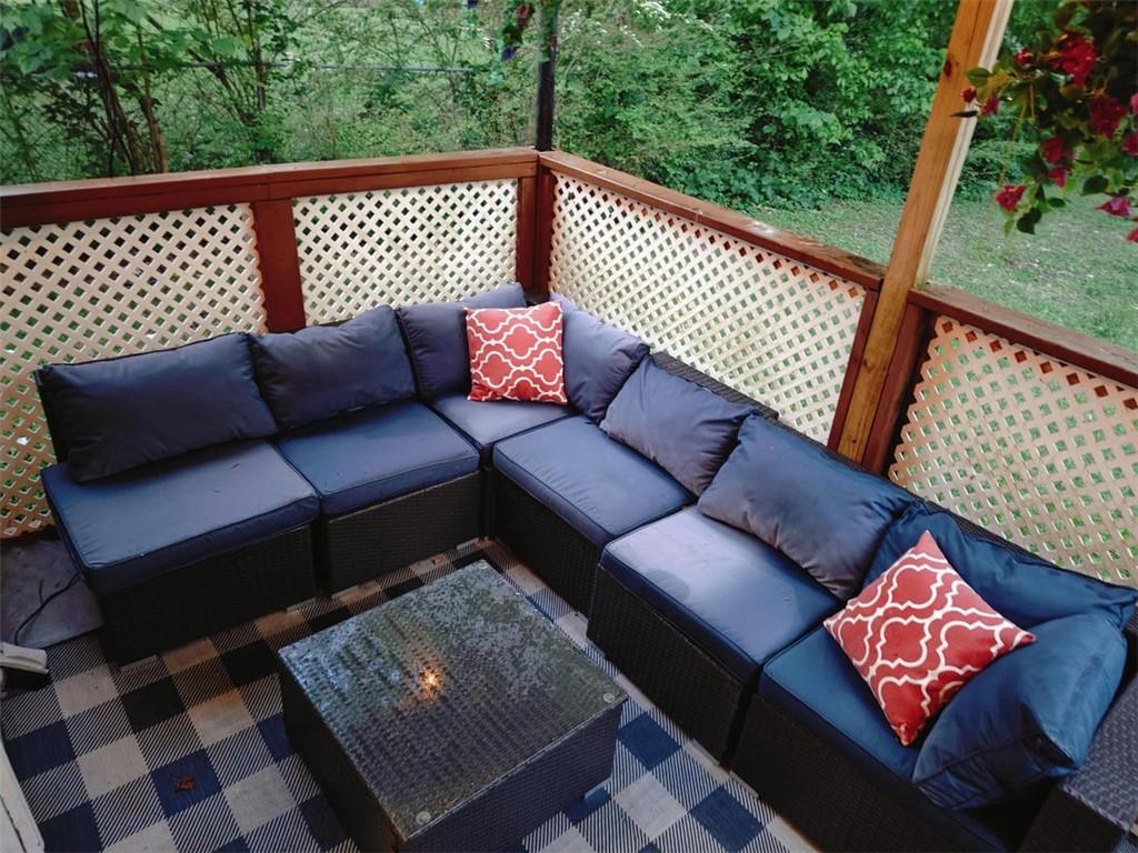 3000 Creel Road Atlanta, GA 30349 - Photo 39 of 52 a outdoor living room with furniture and a rug