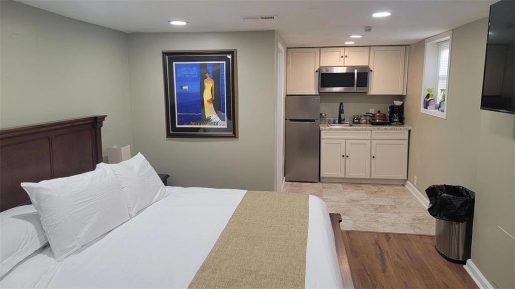 3000 Creel Road Atlanta, GA 30349 - Photo 47 of 52 a bedroom with a bed and furniture