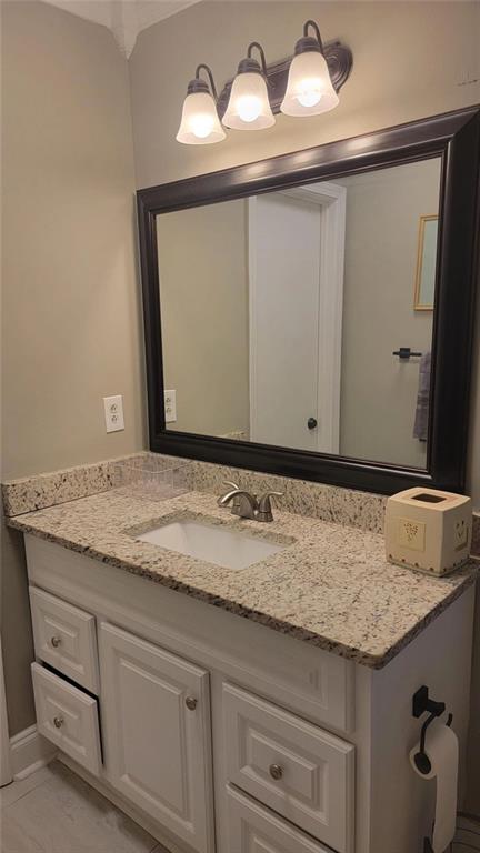 3000 Creel Road Atlanta, GA 30349 - Photo 49 of 52 a bathroom with a granite countertop sink and a mirror