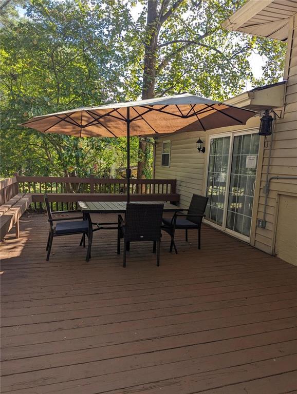 3000 Creel Road Atlanta, GA 30349 - Photo 50 of 52 a view of backyard with table and chairs under an umbrella