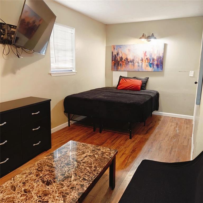 3000 Creel Road Atlanta, GA 30349 - Photo 8 of 52 a bedroom with bed and window