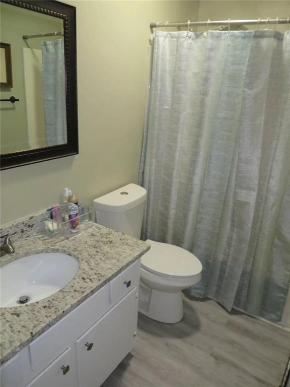 3000 Creel Road Atlanta, GA 30349 - Photo 10 of 52 a bathroom with a granite countertop sink toilet and shower