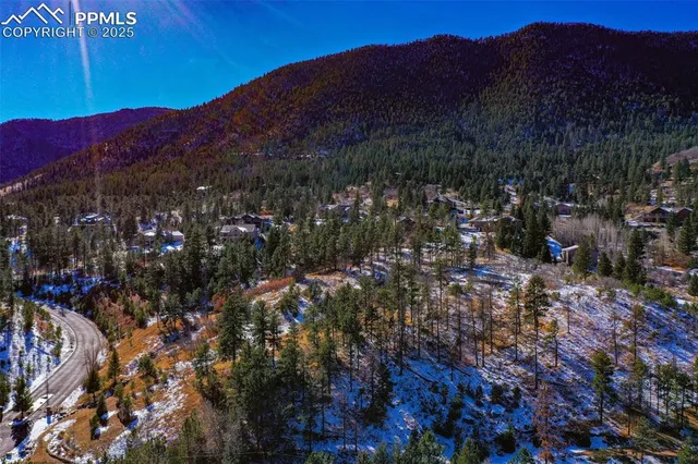 a view of a house with a mountain in the background